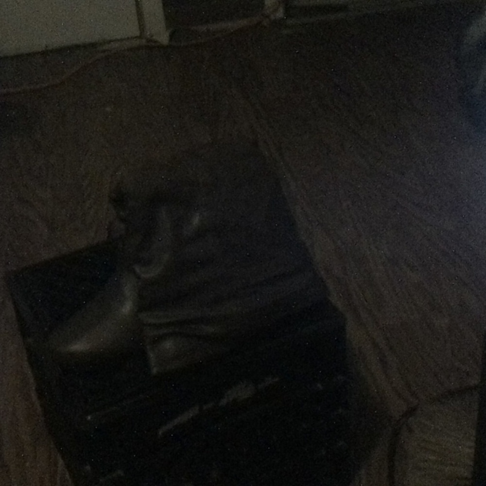 A pair of brown leather boots size 11.